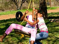 Kids Play on a Tire Swing